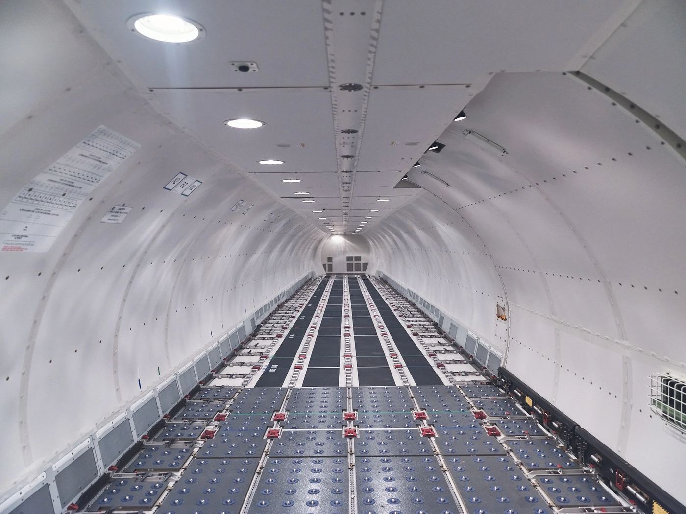 The empty main deck of a 737-800BCF, roller floor running to the tail.